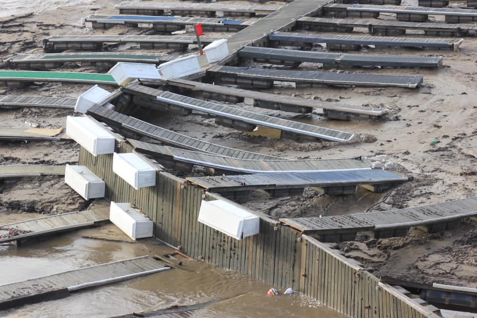Bent and broken dock sections after the November 2024 flood