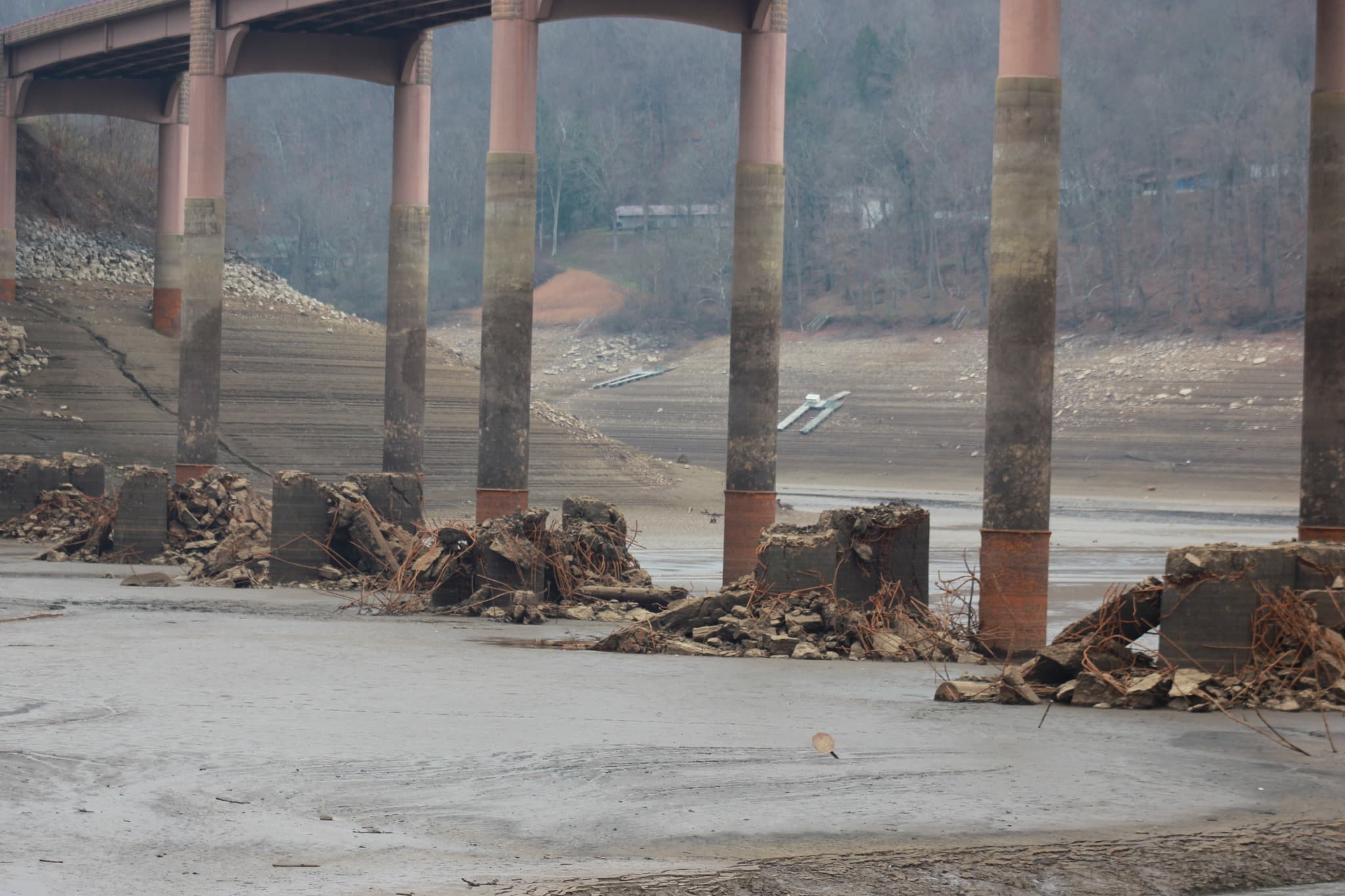 Exposed lakebed under the bridge at record low water levels